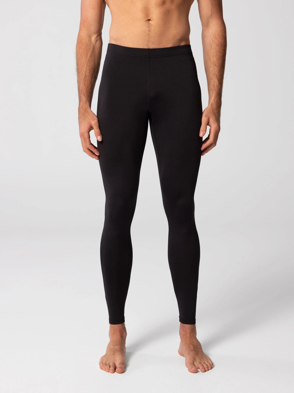 Hot Chillys Men's MEC Ankle Tight Bottom in Black, front view on model
