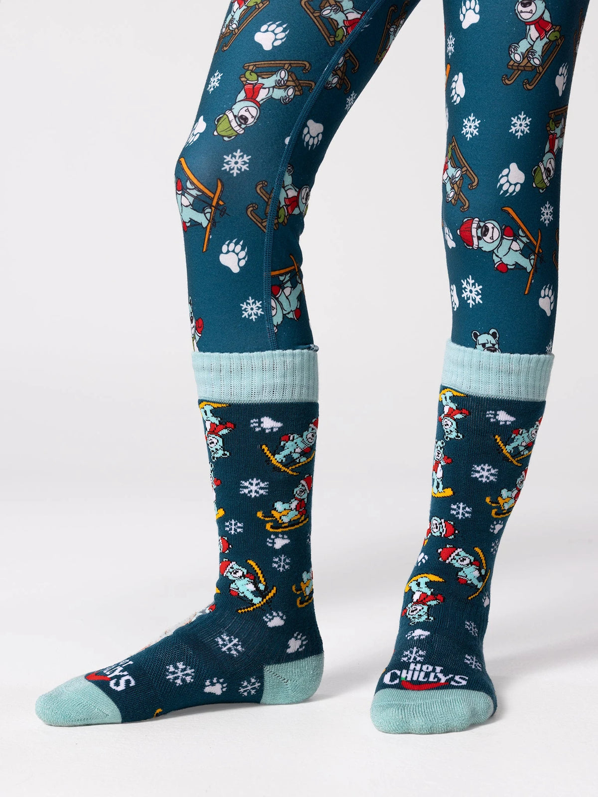Hot Chillys Youth Mid Volume Sock in Snow Bears, front view on model